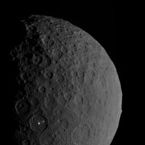 Beauty shot of Ceres, showing both Occator crater with its two bright spots, and the curious Ahuna mons (just on the edge of the limb to the right).